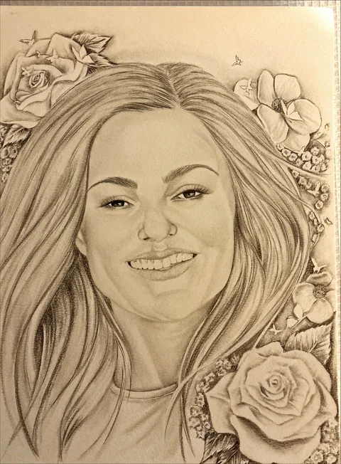 Pencil portrait of a smiling woman with long hair, framed by drawn roses and flowers on a sepia background.