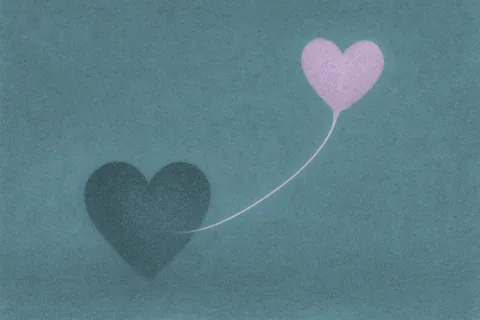 Soft blue-green textured illustration of a dark heart on the ground tethered by a thin string to a floating pink heart-shaped balloon.